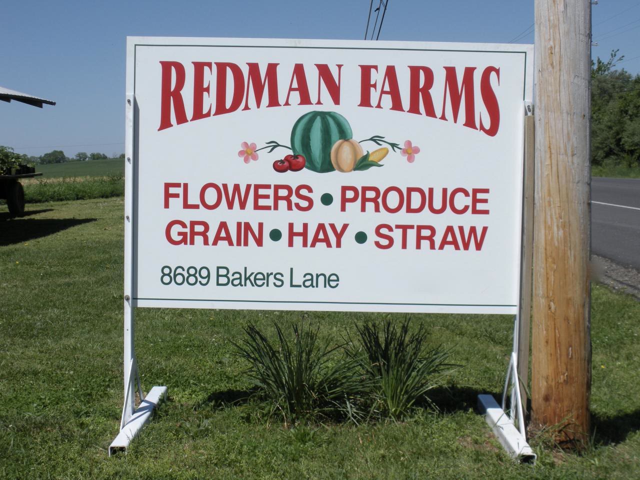 The Redman Farms sign at 8689 Bakers Lane: flowers, produce, grain, hay, straw